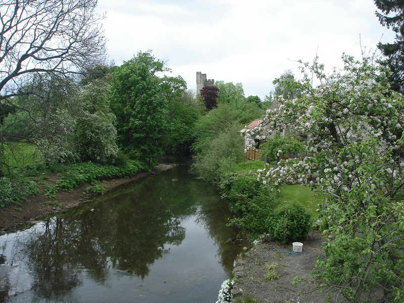 A view along the River Rye looking towards Helmsley Castle