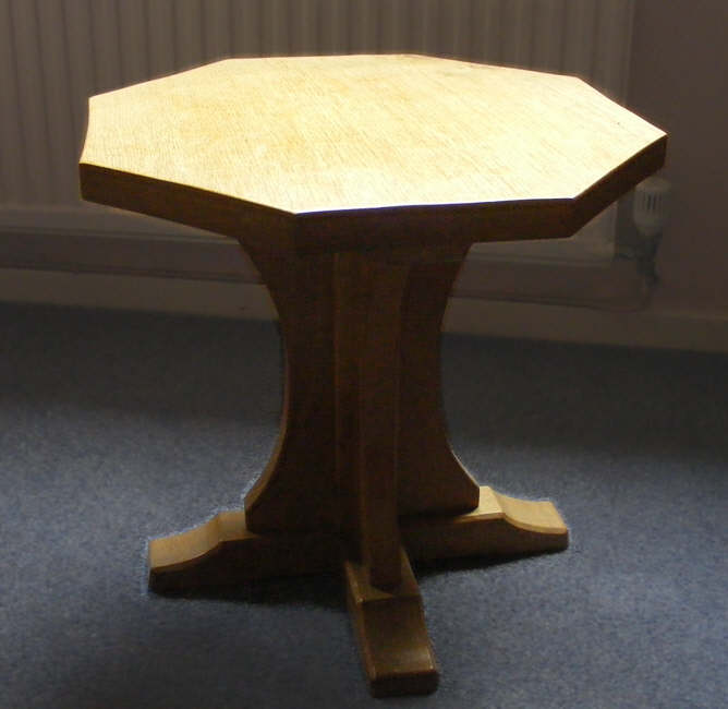 A hexagonal table from Robert Thompson's of Kilburn, showing the clear influence of church furniture on much of his work. 