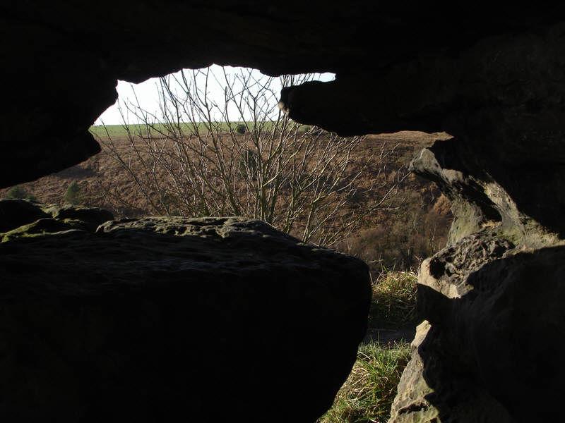 A view taken from the eroded cave on the southernmost of the High Bridestones. 