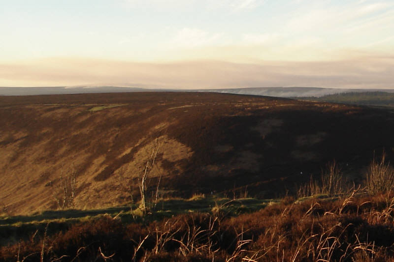 A view west across the Hole of Horcum. In the distance you can see controlled heather fires. 